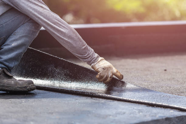 Professional Basement Waterproofing technician working in Westwood, KS